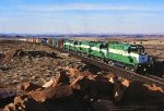 APA, Apache Railway Alcos working hard with 81-900-82-800-83 leading a southbound up grade at mp5 out of Holbrook, Arizona. April 21, 1998. 